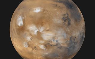 <h1>PIA02653:  Mars Daily Global Image from April 1999</h1><div class="PIA02653" lang="en" style="width:800px;text-align:left;margin:auto;background-color:#000;padding:10px;max-height:150px;overflow:auto;"><p>Twelve orbits a day provide the Mars Global Surveyor MOC wide angle cameras a global "snapshot" of weather patterns across the planet. Here, bluish-white water ice clouds hang above the Tharsis volcanoes. This computer generated image was created by wrapping the global map found at <a href="/catalog/PIA02066">PIA02066</a> onto a sphere. The center of this newly projected sphere is located at 15degrees North, 90 degrees West. This perspective rotates the south pole (which has no data coverage in the original map) away from our field of view.<p>Malin Space Science Systems and the California Institute of Technology built the MOC using spare hardware from the Mars Observer mission. MSSS operates the camera from its facilities in San Diego, CA. The Jet Propulsion Laboratory's Mars Surveyor Operations Project operates the Mars Global Surveyor spacecraft with its industrial partner, Lockheed Martin Astronautics, from facilities in Pasadena, CA and Denver, CO.<br /><br /><a href="http://photojournal.jpl.nasa.gov/catalog/PIA02653" onclick="window.open(this.href); return false;" title="Voir l'image 	 PIA02653:  Mars Daily Global Image from April 1999	  sur le site de la NASA">Voir l'image 	 PIA02653:  Mars Daily Global Image from April 1999	  sur le site de la NASA.</a></div>