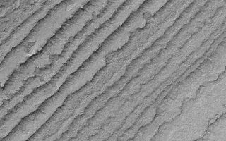 <h1>PIA04801:  South Polar Layers</h1><div class="PIA04801" lang="en" style="width:627px;text-align:left;margin:auto;background-color:#000;padding:10px;max-height:150px;overflow:auto;">MGS MOC Release No. MOC2-516, 17 October 2003<p />This Mars Global Surveyor (MGS) Mars Orbiter Camera (MOC) image shows eroded, stair-stepped layers in the south polar region of Mars. These layers have been considered, for the past three decades, to consist of a mixture of dust and ice. The Mars Polar Lander (MPL) mission was designed to test this hypothesis. However, sadly, MPL was lost during descent in December 1999. This exposure of south polar layered material is located near 86.3°S, 187.7°W. The image covers an area 3 km (1.9 mi) wide and is illuminated by sunlight from the upper left.<br /><br /><a href="http://photojournal.jpl.nasa.gov/catalog/PIA04801" onclick="window.open(this.href); return false;" title="Voir l'image 	 PIA04801:  South Polar Layers	  sur le site de la NASA">Voir l'image 	 PIA04801:  South Polar Layers	  sur le site de la NASA.</a></div>