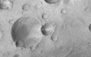 <h1>PIA04808:  Crater Cluster</h1><div class="PIA04808" lang="en" style="width:800px;text-align:left;margin:auto;background-color:#000;padding:10px;max-height:150px;overflow:auto;">MGS MOC Release No. MOC2-521, 22 October 2003<p />This Mars Global Surveyor (MGS) Mars Orbiter Camera (MOC) image shows a cluster of impact craters in northwest Arabia Terra near 30.4°N, 13.7°W. This group of craters may have formed either by secondary impact of debris thrown out of a larger meteor crater, or by the break-up and impact of many fragments from a single incoming object. The picture covers an area 3 km (1.9 mi) wide and is illuminated by sunlight from the lower left.<br /><br /><a href="http://photojournal.jpl.nasa.gov/catalog/PIA04808" onclick="window.open(this.href); return false;" title="Voir l'image 	 PIA04808:  Crater Cluster	  sur le site de la NASA">Voir l'image 	 PIA04808:  Crater Cluster	  sur le site de la NASA.</a></div>