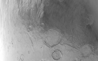 <h1>PIA04810:  Noachis Dust Storm</h1><div class="PIA04810" lang="en" style="width:654px;text-align:left;margin:auto;background-color:#000;padding:10px;max-height:150px;overflow:auto;">MGS MOC Release No. MOC2-523, 24 October 2003<p />The edges of the retreating seasonal polar caps of Mars are sites of frequent dust storms. The temperature contrast between the cold polar cap surfaces and the adjacent, warmer, frost-free surfaces set up the conditions for cold air to come streaming off the polar cap, picking up dust as soon as it hits the frost-free terrain. Dust storms are the result. This Mars Global Surveyor (MGS) Mars Orbiter Camera (MOC) image shows a dust storm in southeast Noachis Terra near 55°S, 316°W, on 21 June 2001. This was one of several precursor storms that led up to the global dust events of 2001. The frosted surface of the seasonal south polar cap is the lighter-toned terrain in the lower half of the image; the darker upper half is frost-free. Winds are blowing the dust storm (located at left-center) toward the north (top/upper right). The large crater just below the center of the picture is Peneus Patera. It is approximately 120 km (~75 mi) across. This MOC red wide angle picture is illuminated by sunlight from the upper left.<br /><br /><a href="http://photojournal.jpl.nasa.gov/catalog/PIA04810" onclick="window.open(this.href); return false;" title="Voir l'image 	 PIA04810:  Noachis Dust Storm	  sur le site de la NASA">Voir l'image 	 PIA04810:  Noachis Dust Storm	  sur le site de la NASA.</a></div>