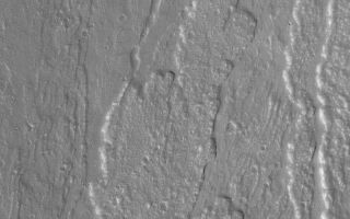 <h1>PIA04812:  Olympus Mons Lava Flows</h1><div class="PIA04812" lang="en" style="width:800px;text-align:left;margin:auto;background-color:#000;padding:10px;max-height:150px;overflow:auto;">MGS MOC Release No. MOC2-525, 26 October 2003<p />This May 2003 Mars Global Surveyor (MGS) Mars Orbiter Camera (MOC) picture shows lava flows on the lower northern flanks of the large martian volcano, Olympus Mons. Located near 21.9°N, 132.9°W, the image features flows that moved down the north slope, toward the north/northeast (top/upper right). Sunlight illuminates this scene from the left/lower left; the picture covers an area about 3 km (1.9 mi) across.<br /><br /><a href="http://photojournal.jpl.nasa.gov/catalog/PIA04812" onclick="window.open(this.href); return false;" title="Voir l'image 	 PIA04812:  Olympus Mons Lava Flows	  sur le site de la NASA">Voir l'image 	 PIA04812:  Olympus Mons Lava Flows	  sur le site de la NASA.</a></div>