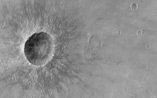 <h1>PIA04815:  Crater in Syrtis Major</h1><div class="PIA04815" lang="en" style="width:799px;text-align:left;margin:auto;background-color:#000;padding:10px;max-height:150px;overflow:auto;">MGS MOC Release No. MOC2-527, 28 October 2003<p />This Mars Global Surveyor (MGS) Mars Orbiter Camera (MOC) picture shows a meteor impact crater in central Syrtis Major. This is a relatively young crater; its ejecta patterns are very well preserved and have not been eroded away by wind or buried by fine sediment. The crater is located near 8.5°N, 295.2°W. The picture covers an area 3 km (1.9 mi) wide and is illuminated by sunlight from the left/upper left.<br /><br /><a href="http://photojournal.jpl.nasa.gov/catalog/PIA04815" onclick="window.open(this.href); return false;" title="Voir l'image 	 PIA04815:  Crater in Syrtis Major	  sur le site de la NASA">Voir l'image 	 PIA04815:  Crater in Syrtis Major	  sur le site de la NASA.</a></div>