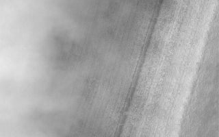 <h1>PIA04836:  Chasma Australe Fog</h1><div class="PIA04836" lang="en" style="width:799px;text-align:left;margin:auto;background-color:#000;padding:10px;max-height:150px;overflow:auto;">MGS MOC Release No. MOC2-528, 29 October 2003<p />Fog is a common occurrence in some areas of the retreating south polar seasonal frost cap. Fogs are commonly banked-up against steep slopes or found inside defrosting craters. This Mars Global Surveyor (MGS) Mars Orbiter Camera (MOC) image captured mid-afternoon fog banked against the layered walls of Chasma Australe, a trough in the south polar region of Mars. The frost-covered layers of Chasma Australe can be seen on the right side of this image, the billowy fog is to the left. Sunlight illuminates this scene from the upper left. The fog, probably composed of water ice crystals, casts shadows on the chasm wall. This picture is located near 83.5°S, 257.9°W, and covers an area 3 km (1.9 mi) wide.<br /><br /><a href="http://photojournal.jpl.nasa.gov/catalog/PIA04836" onclick="window.open(this.href); return false;" title="Voir l'image 	 PIA04836:  Chasma Australe Fog	  sur le site de la NASA">Voir l'image 	 PIA04836:  Chasma Australe Fog	  sur le site de la NASA.</a></div>