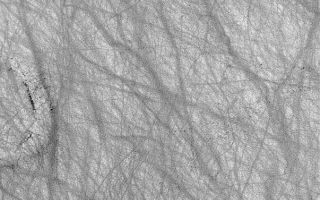 <h1>PIA04864:  Dust Devil Art</h1><div class="PIA04864" lang="en" style="width:603px;text-align:left;margin:auto;background-color:#000;padding:10px;max-height:150px;overflow:auto;">MGS MOC Release No. MOC2-541, 11 November 2003<p />In some regions of Mars, dust devils create streaks by disrupting or removing thin coatings of fine, bright dust from the surface. This summertime view of terrain in southern Noachis Terra, acquired by the Mars Global Surveyor (MGS) Mars Orbiter Camera (MOC), provides an example. Streak patterns such as these are commonly created during the spring and summer in the southern hemisphere; in autumn and winter they are often erased--perhaps by deposition of a new coating of dust--and then a completely different pattern is formed the following spring and summer. This image is located near 59.6°S, 328.8°W. The picture is 3 km (1.9 mi) wide and illuminated by sunlight from the upper left.<br /><br /><a href="http://photojournal.jpl.nasa.gov/catalog/PIA04864" onclick="window.open(this.href); return false;" title="Voir l'image 	 PIA04864:  Dust Devil Art	  sur le site de la NASA">Voir l'image 	 PIA04864:  Dust Devil Art	  sur le site de la NASA.</a></div>