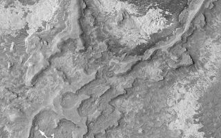 <h1>PIA04874:  Meridiani Sedimentary Rocks</h1><div class="PIA04874" lang="en" style="width:512px;text-align:left;margin:auto;background-color:#000;padding:10px;max-height:150px;overflow:auto;">MGS MOC Release No. MOC2-545, 15 November 2003<p />Northern Sinus Meridiani is a region of vast exposures of layered, sedimentary rock. Buried within these layers are many filled impact craters. Erosion has re-exposed several formerly-buried craters in this Mars Global Surveyor (MGS) Mars Orbiter Camera (MOC) image. Arrows 1 and 2 indicate craters that are still emerging from beneath layered material; arrow 3 indicates a crater that has been fully re-exposed. This image is located near 5.1°N, 2.7°W. The area shown is about 3 km (1.9 mi) wide and illuminated from the left/upper left.<br /><br /><a href="http://photojournal.jpl.nasa.gov/catalog/PIA04874" onclick="window.open(this.href); return false;" title="Voir l'image 	 PIA04874:  Meridiani Sedimentary Rocks	  sur le site de la NASA">Voir l'image 	 PIA04874:  Meridiani Sedimentary Rocks	  sur le site de la NASA.</a></div>