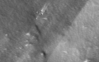 <h1>PIA04897:  Work of Wind on Pavonis Mons</h1><div class="PIA04897" lang="en" style="width:512px;text-align:left;margin:auto;background-color:#000;padding:10px;max-height:150px;overflow:auto;">MGS MOC Release No. MOC2-558, 28 November 2003<p />This Mars Global Surveyor (MGS) Mars Orbiter Camera (MOC) picture presents a high resolution view of the thick, dust-mantled surface of the upper west flank of the volcano, Pavonis Mons. Strong slope winds move and redistribute some of the fine sediment on the surface of this volcano, creating a pattern of light and dark wind streaks. The cluster of craters near the center of the image, for example, have bright tails that indicate winds blew from the lower left (southwest) toward upper right (northeast). This image is located near 0.7°N, 113.4°W. The image covers an area 3 km (1.9 mi) wide, and is illuminated by sunlight from the left/lower left.<br /><br /><a href="http://photojournal.jpl.nasa.gov/catalog/PIA04897" onclick="window.open(this.href); return false;" title="Voir l'image 	 PIA04897:  Work of Wind on Pavonis Mons	  sur le site de la NASA">Voir l'image 	 PIA04897:  Work of Wind on Pavonis Mons	  sur le site de la NASA.</a></div>