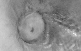 <h1>PIA04930:  Clouds Near Mie Crater</h1><div class="PIA04930" lang="en" style="width:511px;text-align:left;margin:auto;background-color:#000;padding:10px;max-height:150px;overflow:auto;">MGS MOC Release No. MOC2-572, 12 December 2003<p />Mie Crater, a large basin formed by asteroid or comet impact in Utopia Planitia, lies at the center of this Mars Global Surveyor (MGS) Mars Orbiter Camera (MOC) red wide angle image. The crater is approximately 104 km (65 mi) across. To the east and southeast (toward the lower right) of Mie, in this 5 December 2003 view, are clouds of dust and water ice kicked up by local dust storm activity. It is mid-winter in the northern hemisphere of Mars, a time when passing storms are common on the northern plains of the red planet. Sunlight illuminates this image from the lower left; Mie Crater is located at 48.5°N, 220.3°W. Viking 2 landed west/southwest of Mie Crater, off the left edge of this image, in September 1976.<br /><br /><a href="http://photojournal.jpl.nasa.gov/catalog/PIA04930" onclick="window.open(this.href); return false;" title="Voir l'image 	 PIA04930:  Clouds Near Mie Crater	  sur le site de la NASA">Voir l'image 	 PIA04930:  Clouds Near Mie Crater	  sur le site de la NASA.</a></div>