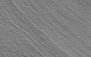 <h1>PIA05791:  Fretted Terrain Valley</h1><div class="PIA05791" lang="en" style="width:293px;text-align:left;margin:auto;background-color:#000;padding:10px;max-height:150px;overflow:auto;"><p>17 April 2004<br />This Mars Global Surveyor (MGS) Mars Orbiter Camera (MOC) image shows a typical fretted terrain valley floor, located southwest of Moreux Crater near 40.3°N, 317.7°W. Prior to the MGS mission, images from the Viking and Mariner 9 orbiters led to speculation that the lineated floors of fretted terrain valleys indicated the results of flowing ice. MGS MOC images have shown that these lineations occur in closed, as well as open, fretted terrain valleys. The lineations might, therefore, have nothing to do with flowing ice. They might instead be an expression of eroded layered material. Studies of fretted terrain landforms are on-going within the Mars science community. This January 2004 image covers an area about 3 km (1.9 mi) across. Sunlight illuminates the scene from the lower left.</p><br /><br /><a href="http://photojournal.jpl.nasa.gov/catalog/PIA05791" onclick="window.open(this.href); return false;" title="Voir l'image 	 PIA05791:  Fretted Terrain Valley	  sur le site de la NASA">Voir l'image 	 PIA05791:  Fretted Terrain Valley	  sur le site de la NASA.</a></div>