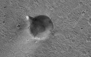 <h1>PIA05919:  Ares Vallis Dust Devil</h1><div class="PIA05919" lang="en" style="width:512px;text-align:left;margin:auto;background-color:#000;padding:10px;max-height:150px;overflow:auto;"><p>12 May 2004<br />When it was operating in the Ares/Tiu Valles region of Chryse Planitia, Mars, in 1997, Mars Pathfinder detected dust devils that passed over and near the lander. From orbit, no images of dust devils at the Mars Pathfinder site have yet been acquired, but this Mars Global Surveyor (MGS) Mars Orbiter Camera (MOC) image shows a summertime dust devil near the rim of a 610-meter (~670 yards)-diameter impact crater in the same general region as the Mars Pathfinder site. This scene is near 19.6°N, 32.9°W, in part of the Ares Vallis system. The dust devil in this case is not making a streak, as dust devils tend to do in some regions of Mars. The dark feature to the right (east) of the dust devil is its shadow. This picture covers an area approximately 3 km (1.9 mi) across and is illuminated by sunlight from the left/upper left.</p><br /><br /><a href="http://photojournal.jpl.nasa.gov/catalog/PIA05919" onclick="window.open(this.href); return false;" title="Voir l'image 	 PIA05919:  Ares Vallis Dust Devil	  sur le site de la NASA">Voir l'image 	 PIA05919:  Ares Vallis Dust Devil	  sur le site de la NASA.</a></div>