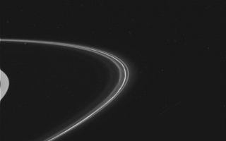 <h1>PIA06098:  Wide View of Saturn's F Ring</h1><div class="PIA06098" lang="en" style="width:800px;text-align:left;margin:auto;background-color:#000;padding:10px;max-height:150px;overflow:auto;"><p>This is one of the first images taken of Saturn's F ring by the Cassini spacecraft after it successfully entered Saturn's orbit. It was taken by the spacecraft's wide angle camera and shows the sunlit side of the rings.</p><br /><br /><a href="http://photojournal.jpl.nasa.gov/catalog/PIA06098" onclick="window.open(this.href); return false;" title="Voir l'image 	 PIA06098:  Wide View of Saturn's F Ring	  sur le site de la NASA">Voir l'image 	 PIA06098:  Wide View of Saturn's F Ring	  sur le site de la NASA.</a></div>