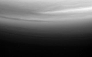 <h1>PIA06182:  Titans Waves?</h1><div class="PIA06182" lang="en" style="width:800px;text-align:left;margin:auto;background-color:#000;padding:10px;max-height:150px;overflow:auto;"><p>Multiple upper stratospheric haze layers are evident in this ultraviolet view from Cassini looking toward Titan's south pole. The alternating bright and dark bands may be due to differing haze concentrations produced by what may be gravity wave motions (the atmospheric equivalent of ripples on a pond), or perhaps they are evidence of shadows cast by haze layers moving upward as waves pass by in the atmosphere. East-west waves suggestive of other wave motions are also visible in these layers.</p><p>The image was taken with the Cassini spacecraft narrow angle camera on Feb. 14, 2005, through a filter sensitive to wavelengths of polarized ultraviolet light centered at 338 nanometers. The image was acquired at a distance of approximately 151,000 kilometers (94,000 miles) from Titan and at a Sun-Titan-spacecraft, or phase, angle of 20 degrees. Resolution in the image is about 900 meters (3,000 feet) per pixel. </p><p>The Cassini-Huygens mission is a cooperative project of NASA, the European Space Agency and the Italian Space Agency. The Jet Propulsion Laboratory, a division of the California Institute of Technology in Pasadena, manages the mission for NASA's Science Mission Directorate, Washington, D.C. The Cassini orbiter and its two onboard cameras were designed, developed and assembled at JPL. The imaging team is based at the Space Science Institute, Boulder, Colo.</p><p>For more information about the Cassini-Huygens mission, visit <a href="http://saturn.jpl.nasa.gov">http://saturn.jpl.nasa.gov</a> and the Cassini imaging team home page, <a href="http://ciclops.org">http://ciclops.org</a>.</p><br /><br /><a href="http://photojournal.jpl.nasa.gov/catalog/PIA06182" onclick="window.open(this.href); return false;" title="Voir l'image 	 PIA06182:  Titans Waves?	  sur le site de la NASA">Voir l'image 	 PIA06182:  Titans Waves?	  sur le site de la NASA.</a></div>