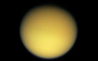 <h1>PIA06183:  Hazy Days on Titan</h1><div class="PIA06183" lang="en" style="width:717px;text-align:left;margin:auto;background-color:#000;padding:10px;max-height:150px;overflow:auto;"><p>Saturn's large, smog-enshrouded moon Titan greets Cassini in full color as the spacecraft makes its third close pass on Feb. 15, 2005.</p><p>This view has been rotated so that north on Titan is up. There is a slight difference in brightness from north to south, a seasonal effect that was noted in NASA's Voyager spacecraft images, and is clearly visible in some infrared images from Cassini (see <a href="/catalog/PIA06121">PIA06121</a>). The northern polar region is largely in darkness at this time.</p><p>This image was taken with the Cassini spacecraft wide angle camera through using red, green and blue spectral filters were combined to create this natural color view. The image was acquired at a distance of approximately 229,000 kilometers (142,000 miles) from Titan and at a Sun-Titan-spacecraft, or phase, angle of 20 degrees. Resolution in the image is about 14 kilometers (9 miles) per pixel.</p><p>The Cassini-Huygens mission is a cooperative project of NASA, the European Space Agency and the Italian Space Agency. The Jet Propulsion Laboratory, a division of the California Institute of Technology in Pasadena, manages the mission for NASA's Science Mission Directorate, Washington, D.C. The Cassini orbiter and its two onboard cameras were designed, developed and assembled at JPL. The imaging team is based at the Space Science Institute, Boulder, Colo.</p><p>For more information about the Cassini-Huygens mission, visit <a href="http://saturn.jpl.nasa.gov">http://saturn.jpl.nasa.gov</a> and the Cassini imaging team home page, <a href="http://ciclops.org">http://ciclops.org</a>.</p><br /><br /><a href="http://photojournal.jpl.nasa.gov/catalog/PIA06183" onclick="window.open(this.href); return false;" title="Voir l'image 	 PIA06183:  Hazy Days on Titan	  sur le site de la NASA">Voir l'image 	 PIA06183:  Hazy Days on Titan	  sur le site de la NASA.</a></div>