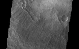 <h1>PIA06861:  Ius Chasma Landslide</h1><div class="PIA06861" lang="en" style="width:605px;text-align:left;margin:auto;background-color:#000;padding:10px;max-height:150px;overflow:auto;"><a href="/figures/PIA06861_fig1.jpg"> </a><br /><p>The Odyssey spacecraft has taken some great pictures of Valles Marineris, the largest canyon in the solar system. If this canyon were on Earth, it would stretch from New York to Los Angeles. For the next several weeks, the Image of the Day will tour some of the canyons that make up this vast system. We will start with Ius Chasma in the west, and end with Coprates Chasma to the east. For more information on Vallis Marineris, please see <a href="http://mars.jpl.nasa.gov/mep/science/vm.html">http://mars.jpl.nasa.gov/mep/science/vm.html</a>.</p><p>In this image, there is evidence of a large landslide. Landslides are common throughout Valles Marineris, but are particularly common here in Ius Chasma.</p>Image information: VIS instrument. Latitude -7.9, Longitude 281.1 East (78.9 West). 19 meter/pixel resolution.</p><p>Note: this THEMIS visual image has not been radiometrically nor geometrically calibrated for this preliminary release. An empirical correction has been performed to remove instrumental effects. A linear shift has been applied in the cross-track and down-track direction to approximate spacecraft and planetary motion. Fully calibrated and geometrically projected images will be released through the Planetary Data System in accordance with Project policies at a later time.</p><p>NASA's Jet Propulsion Laboratory manages the 2001 Mars Odyssey mission for NASA's Office of Space Science, Washington, D.C. The Thermal Emission Imaging System (THEMIS) was developed by Arizona State University, Tempe, in collaboration with Raytheon Santa Barbara Remote Sensing. The THEMIS investigation is led by Dr. Philip Christensen at Arizona State University. Lockheed Martin Astronautics, Denver, is the prime contractor for the Odyssey project, and developed and built the orbiter. Mission operations are conducted jointly from Lockheed Martin and from JPL, a division of the California Institute of Technology in Pasadena.</p><br /><br /><a href="http://photojournal.jpl.nasa.gov/catalog/PIA06861" onclick="window.open(this.href); return false;" title="Voir l'image 	 PIA06861:  Ius Chasma Landslide	  sur le site de la NASA">Voir l'image 	 PIA06861:  Ius Chasma Landslide	  sur le site de la NASA.</a></div>