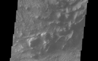 <h1>PIA06874:  Candor Chasma's Rim</h1><div class="PIA06874" lang="en" style="width:508px;text-align:left;margin:auto;background-color:#000;padding:10px;max-height:150px;overflow:auto;"><a href="/figures/PIA06874_fig1.jpg"> </a><br /><p>The Odyssey spacecraft has taken some great pictures of Valles Marineris, the largest canyon in the solar system. If this canyon were on Earth, it would stretch from New York to Los Angeles. For the next several weeks, the Image of the Day will tour some of the canyons that make up this vast system. We will start with Ius Chasma in the west, and end with Coprates Chasma to the east. For more information on Vallis Marineris, please see <a href="http://mars.jpl.nasa.gov/mep/science/vm.html">http://mars.jpl.nasa.gov/mep/science/vm.html</a>.</p><p>This image shows Candor Chasma's northern rim. Just below the canyon wall is debris material that once formed part of the canyon wall. The bottom part of the image shows eroded layered rock surfaces.</p>Image information: VIS instrument. Latitude -4.9, Longitude 283.8 East (76.2 West). 19 meter/pixel resolution.</p><p>Note: this THEMIS visual image has not been radiometrically nor geometrically calibrated for this preliminary release. An empirical correction has been performed to remove instrumental effects. A linear shift has been applied in the cross-track and down-track direction to approximate spacecraft and planetary motion. Fully calibrated and geometrically projected images will be released through the Planetary Data System in accordance with Project policies at a later time.</p><p>NASA's Jet Propulsion Laboratory manages the 2001 Mars Odyssey mission for NASA's Office of Space Science, Washington, D.C. The Thermal Emission Imaging System (THEMIS) was developed by Arizona State University, Tempe, in collaboration with Raytheon Santa Barbara Remote Sensing. The THEMIS investigation is led by Dr. Philip Christensen at Arizona State University. Lockheed Martin Astronautics, Denver, is the prime contractor for the Odyssey project, and developed and built the orbiter. Mission operations are conducted jointly from Lockheed Martin and from JPL, a division of the California Institute of Technology in Pasadena.</p><br /><br /><a href="http://photojournal.jpl.nasa.gov/catalog/PIA06874" onclick="window.open(this.href); return false;" title="Voir l'image 	 PIA06874:  Candor Chasma's Rim	  sur le site de la NASA">Voir l'image 	 PIA06874:  Candor Chasma's Rim	  sur le site de la NASA.</a></div>