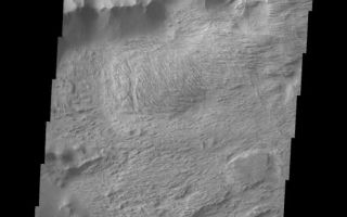 <h1>PIA06888:  Candor Chasma Plateau</h1><div class="PIA06888" lang="en" style="width:508px;text-align:left;margin:auto;background-color:#000;padding:10px;max-height:150px;overflow:auto;"><a href="/figures/PIA06888_fig1.jpg"> </a><br /><p>The Odyssey spacecraft has taken some great pictures of Valles Marineris, the largest canyon in the solar system. If this canyon were on Earth, it would stretch from New York to Los Angeles. For the next several weeks, the Image of the Day will tour some of the canyons that make up this vast system. We will start with Ius Chasma in the west, and end with Coprates Chasma to the east. For more information on Vallis Marineris, please see <a href="http://mars.jpl.nasa.gov/mep/science/vm.html">http://mars.jpl.nasa.gov/mep/science/vm.html</a>.</p><p>This image shows a part of Candor Chasma. wind etched surfaces are dominant on this picture, but gullies and layered rock formations are also present in this area. The southernmost part of the image shows the plateau area which is thought to predate to the Chasma formation.</p><p>Image information: VIS instrument. Latitude -5.2, Longitude 282.9 East (771. West). 19 meter/pixel resolution.</p><p>Note: this THEMIS visual image has not been radiometrically nor geometrically calibrated for this preliminary release. An empirical correction has been performed to remove instrumental effects. A linear shift has been applied in the cross-track and down-track direction to approximate spacecraft and planetary motion. Fully calibrated and geometrically projected images will be released through the Planetary Data System in accordance with Project policies at a later time.</p><p>NASA's Jet Propulsion Laboratory manages the 2001 Mars Odyssey mission for NASA's Office of Space Science, Washington, D.C. The Thermal Emission Imaging System (THEMIS) was developed by Arizona State University, Tempe, in collaboration with Raytheon Santa Barbara Remote Sensing. The THEMIS investigation is led by Dr. Philip Christensen at Arizona State University. Lockheed Martin Astronautics, Denver, is the prime contractor for the Odyssey project, and developed and built the orbiter. Mission operations are conducted jointly from Lockheed Martin and from JPL, a division of the California Institute of Technology in Pasadena.</p><br /><br /><a href="http://photojournal.jpl.nasa.gov/catalog/PIA06888" onclick="window.open(this.href); return false;" title="Voir l'image 	 PIA06888:  Candor Chasma Plateau	  sur le site de la NASA">Voir l'image 	 PIA06888:  Candor Chasma Plateau	  sur le site de la NASA.</a></div>
