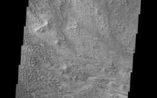 <h1>PIA06901:  Wind Etching in Candor Chasma</h1><div class="PIA06901" lang="en" style="width:530px;text-align:left;margin:auto;background-color:#000;padding:10px;max-height:150px;overflow:auto;"><a href="/figures/PIA06901_fig1.jpg"> </a><br /><p>The Odyssey spacecraft has taken some great pictures of Valles Marineris, the largest canyon in the solar system. If this canyon were on Earth, it would stretch from New York to Los Angeles. For the next several weeks, the Image of the Day will tour some of the canyons that make up this vast system. We will start with Ius Chasma in the west, and end with Coprates Chasma to the east. For more information on Vallis Marineris, please see <a href="http://mars.jpl.nasa.gov/mep/science/vm.html">http://mars.jpl.nasa.gov/mep/science/vm.html</a>.</p><p>This image shows a wind etched area in Candor Chasma.</p>Image information: VIS instrument. Latitude -6.3, Longitude 283 East (77 West). 19 meter/pixel resolution.</p><p>Note: this THEMIS visual image has not been radiometrically nor geometrically calibrated for this preliminary release. An empirical correction has been performed to remove instrumental effects. A linear shift has been applied in the cross-track and down-track direction to approximate spacecraft and planetary motion. Fully calibrated and geometrically projected images will be released through the Planetary Data System in accordance with Project policies at a later time.</p><p>NASA's Jet Propulsion Laboratory manages the 2001 Mars Odyssey mission for NASA's Office of Space Science, Washington, D.C. The Thermal Emission Imaging System (THEMIS) was developed by Arizona State University, Tempe, in collaboration with Raytheon Santa Barbara Remote Sensing. The THEMIS investigation is led by Dr. Philip Christensen at Arizona State University. Lockheed Martin Astronautics, Denver, is the prime contractor for the Odyssey project, and developed and built the orbiter. Mission operations are conducted jointly from Lockheed Martin and from JPL, a division of the California Institute of Technology in Pasadena.</p><br /><br /><a href="http://photojournal.jpl.nasa.gov/catalog/PIA06901" onclick="window.open(this.href); return false;" title="Voir l'image 	 PIA06901:  Wind Etching in Candor Chasma	  sur le site de la NASA">Voir l'image 	 PIA06901:  Wind Etching in Candor Chasma	  sur le site de la NASA.</a></div>