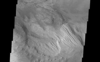 <h1>PIA06906:  Layered Candor Chasma</h1><div class="PIA06906" lang="en" style="width:533px;text-align:left;margin:auto;background-color:#000;padding:10px;max-height:150px;overflow:auto;"><a href="/figures/PIA06906_fig1.jpg"> </a><br /><p>The Odyssey spacecraft has taken some great pictures of Valles Marineris, the largest canyon in the solar system. If this canyon were on Earth, it would stretch from New York to Los Angeles. For the next several weeks, the Image of the Day will tour some of the canyons that make up this vast system. We will start with Ius Chasma in the west, and end with Coprates Chasma to the east. For more information on Vallis Marineris, please see <a href="http://mars.jpl.nasa.gov/mep/science/vm.html">http://mars.jpl.nasa.gov/mep/science/vm.html</a>.</p><p>This image shows an area in Candor Chasma. The imaged area is close to the depression that connects Candor and Melas Chasmas together. The image's top part shows parts of one of the large deposits that lie in the middle of Candor Chasma. Wind etched lines and gullies can be seen on this downward sloping area. The image's middle part show another layered deposited area with dunes on the Chasma floor around it.</p>Image information: VIS instrument. Latitude -7.1, Longitude 288.8 East (71.2 West). 19 meter/pixel resolution.</p><p>Note: this THEMIS visual image has not been radiometrically nor geometrically calibrated for this preliminary release. An empirical correction has been performed to remove instrumental effects. A linear shift has been applied in the cross-track and down-track direction to approximate spacecraft and planetary motion. Fully calibrated and geometrically projected images will be released through the Planetary Data System in accordance with Project policies at a later time.</p><p>NASA's Jet Propulsion Laboratory manages the 2001 Mars Odyssey mission for NASA's Office of Space Science, Washington, D.C. The Thermal Emission Imaging System (THEMIS) was developed by Arizona State University, Tempe, in collaboration with Raytheon Santa Barbara Remote Sensing. The THEMIS investigation is led by Dr. Philip Christensen at Arizona State University. Lockheed Martin Astronautics, Denver, is the prime contractor for the Odyssey project, and developed and built the orbiter. Mission operations are conducted jointly from Lockheed Martin and from JPL, a division of the California Institute of Technology in Pasadena.</p><br /><br /><a href="http://photojournal.jpl.nasa.gov/catalog/PIA06906" onclick="window.open(this.href); return false;" title="Voir l'image 	 PIA06906:  Layered Candor Chasma	  sur le site de la NASA">Voir l'image 	 PIA06906:  Layered Candor Chasma	  sur le site de la NASA.</a></div>