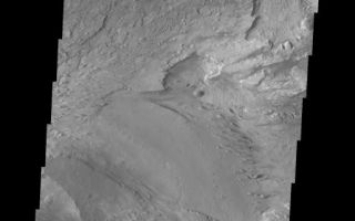 <h1>PIA06911:  Candor Chasma</h1><div class="PIA06911" lang="en" style="width:514px;text-align:left;margin:auto;background-color:#000;padding:10px;max-height:150px;overflow:auto;"><a href="/figures/PIA06911_fig1.jpg"> </a><br /><p>The Odyssey spacecraft has taken some great pictures of Valles Marineris, the largest canyon in the solar system. If this canyon were on Earth, it would stretch from New York to Los Angeles. For the next several weeks, the Image of the Day will tour some of the canyons that make up this vast system. We will start with Ius Chasma in the west, and end with Coprates Chasma to the east. For more information on Vallis Marineris, please see <a href="http://mars.jpl.nasa.gov/mep/science/vm.html">http://mars.jpl.nasa.gov/mep/science/vm.html</a>.</p><p>This image shows an area in Candor Chasma. Layered surfaces and wind etched surfaces are present in this area.</p>Image information: VIS instrument. Latitude -5.3, Longitude 283.2 East (76.8 West). 19 meter/pixel resolution.</p><p>Note: this THEMIS visual image has not been radiometrically nor geometrically calibrated for this preliminary release. An empirical correction has been performed to remove instrumental effects. A linear shift has been applied in the cross-track and down-track direction to approximate spacecraft and planetary motion. Fully calibrated and geometrically projected images will be released through the Planetary Data System in accordance with Project policies at a later time.</p><p>NASA's Jet Propulsion Laboratory manages the 2001 Mars Odyssey mission for NASA's Office of Space Science, Washington, D.C. The Thermal Emission Imaging System (THEMIS) was developed by Arizona State University, Tempe, in collaboration with Raytheon Santa Barbara Remote Sensing. The THEMIS investigation is led by Dr. Philip Christensen at Arizona State University. Lockheed Martin Astronautics, Denver, is the prime contractor for the Odyssey project, and developed and built the orbiter. Mission operations are conducted jointly from Lockheed Martin and from JPL, a division of the California Institute of Technology in Pasadena.</p><br /><br /><a href="http://photojournal.jpl.nasa.gov/catalog/PIA06911" onclick="window.open(this.href); return false;" title="Voir l'image 	 PIA06911:  Candor Chasma	  sur le site de la NASA">Voir l'image 	 PIA06911:  Candor Chasma	  sur le site de la NASA.</a></div>