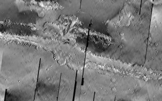 <h1>PIA06926:  Valles Marineris Mosaic</h1><div class="PIA06926" lang="en" style="width:800px;text-align:left;margin:auto;background-color:#000;padding:10px;max-height:150px;overflow:auto;"><p>The Odyssey spacecraft has taken some great pictures of Valles Marineris, the largest canyon in the solar system. If this canyon were on Earth, it would stretch from New York to Los Angeles. For the next several weeks, the Image of the Day will tour some of the canyons that make up this vast system. We will start with Ius Chasma in the west, and end with Coprates Chasma to the east. For more information on Vallis Marineris, please see <a href="http://mars.jpl.nasa.gov/mep/science/vm.html">http://mars.jpl.nasa.gov/mep/science/vm.html</a>.</p><p>This mosaic of infrared images shows the full length of Valles Marineris.</p><p>For highest resolution TIF image please visit <a href="http://themis.la.asu.edu/zoom-20041008A.html">http://themis.la.asu.edu/zoom-20041008A.html</a>.</p><p>Note: this THEMIS visual image has not been radiometrically nor geometrically calibrated for this preliminary release. An empirical correction has been performed to remove instrumental effects. A linear shift has been applied in the cross-track and down-track direction to approximate spacecraft and planetary motion. Fully calibrated and geometrically projected images will be released through the Planetary Data System in accordance with Project policies at a later time.</p><p>NASA's Jet Propulsion Laboratory manages the 2001 Mars Odyssey mission for NASA's Office of Space Science, Washington, D.C. The Thermal Emission Imaging System (THEMIS) was developed by Arizona State University, Tempe, in collaboration with Raytheon Santa Barbara Remote Sensing. The THEMIS investigation is led by Dr. Philip Christensen at Arizona State University. Lockheed Martin Astronautics, Denver, is the prime contractor for the Odyssey project, and developed and built the orbiter. Mission operations are conducted jointly from Lockheed Martin and from JPL, a division of the California Institute of Technology in Pasadena.</p><br /><br /><a href="http://photojournal.jpl.nasa.gov/catalog/PIA06926" onclick="window.open(this.href); return false;" title="Voir l'image 	 PIA06926:  Valles Marineris Mosaic	  sur le site de la NASA">Voir l'image 	 PIA06926:  Valles Marineris Mosaic	  sur le site de la NASA.</a></div>