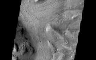 <h1>PIA06957:  Reull Vallis</h1><div class="PIA06957" lang="en" style="width:561px;text-align:left;margin:auto;background-color:#000;padding:10px;max-height:150px;overflow:auto;"><a href="/figures/PIA06957_fig1.jpg"> </a><br /><p>This week we will be examining images of Reull Vallis. Reull Vallis is located in the Martian southern highlands, just east of Hellas Basin. This extensive channel system records an interesting fluvial and mass wasting geologic history of the area. In many images show interesting patterns of mass wasted material in the bottom of the channel. For more information on the geology of Reull Vallis see <a href="http://viking.eps.pitt.edu/public/IcarusPub/Geol_RVR_Icarus.html">http://viking.eps.pitt.edu/public/IcarusPub/Geol_RVR_Icarus.html</a>.</p><p>Image information:VIS instrument. Latitude -42.5, Longitude 103.2 East (256.8 West). 19 meter/pixel resolution.</p><p>Note: this THEMIS visual image has not been radiometrically nor geometrically calibrated for this preliminary release. An empirical correction has been performed to remove instrumental effects. A linear shift has been applied in the cross-track and down-track direction to approximate spacecraft and planetary motion. Fully calibrated and geometrically projected images will be released through the Planetary Data System in accordance with Project policies at a later time.</p><p>NASA's Jet Propulsion Laboratory manages the 2001 Mars Odyssey mission for NASA's Office of Space Science, Washington, D.C. The Thermal Emission Imaging System (THEMIS) was developed by Arizona State University, Tempe, in collaboration with Raytheon Santa Barbara Remote Sensing. The THEMIS investigation is led by Dr. Philip Christensen at Arizona State University. Lockheed Martin Astronautics, Denver, is the prime contractor for the Odyssey project, and developed and built the orbiter. Mission operations are conducted jointly from Lockheed Martin and from JPL, a division of the California Institute of Technology in Pasadena.</p><br /><br /><a href="http://photojournal.jpl.nasa.gov/catalog/PIA06957" onclick="window.open(this.href); return false;" title="Voir l'image 	 PIA06957:  Reull Vallis	  sur le site de la NASA">Voir l'image 	 PIA06957:  Reull Vallis	  sur le site de la NASA.</a></div>