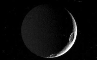 <h1>PIA07577:  Tethys in the Dark</h1><div class="PIA07577" lang="en" style="width:369px;text-align:left;margin:auto;background-color:#000;padding:10px;max-height:150px;overflow:auto;"><p>A close inspection of this image reveals that there is more of Saturn's moon Tethys here than is apparent at first glance. A slim crescent is all that is visible of the moon's sunlit side, but the left half of the image is dimly lit by "Saturnshine," or reflected light from the planet lying off to the left of Cassini's field of view. Tethys is 1,071 kilometers (665 miles) across.</p><p>On occasion, useful details about a moon's surface characteristics can be revealed under such dim illumination, as in <a href="/catalog/PIA06168">PIA06168</a>.</p><p>This view shows principally the Saturn-facing hemisphere of Tethys; north is up. Craters along the terminator, the boundary between day and night, are Penelope (at the top) and Antinous (at the bottom).</p><p>The image was taken with the Cassini spacecraft narrow-angle camera on Aug. 3, 2005. The spacecraft was approximately 842,000 kilometers (523,000 miles) from Tethys. The image was taken with a filter sensitive to wavelengths of polarized ultraviolet light centered at 338 nanometers from Tethys and at a Sun-Tethys-spacecraft, or phase, angle of 144 degrees. Image scale is 5 kilometers (3 miles) per pixel.<br /><br /><a href="http://photojournal.jpl.nasa.gov/catalog/PIA07577" onclick="window.open(this.href); return false;" title="Voir l'image 	 PIA07577:  Tethys in the Dark	  sur le site de la NASA">Voir l'image 	 PIA07577:  Tethys in the Dark	  sur le site de la NASA.</a></div>