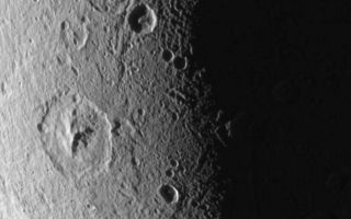 <h1>PIA07692:  Dione: Magnified View</h1><div class="PIA07692" lang="en" style="width:800px;text-align:left;margin:auto;background-color:#000;padding:10px;max-height:150px;overflow:auto;"><p>This close-up of Dione's icy surface shows deeply shadowed craters near the terminator, as well as a group of roughly linear faults above center.</p><p>The terrain shown here is on the moon's leading hemisphere. North on Dione (1,126 kilometers, or 700 miles across) is up and tilted 21 degrees to the right.</p><p>The image was taken in visible green light with the Cassini spacecraft narrow-angle camera on Dec. 24, 2005 at a distance of approximately 152,000 kilometers (94,000 miles) from Dione and at a Sun-Dione-spacecraft, or phase, angle of 109 degrees. Resolution in the original image was 904 meters (2,965 feet) per pixel. The image has been magnified by a factor of two and contrast-enhanced to aid visibility.</p><p>The Cassini-Huygens mission is a cooperative project of NASA, the European Space Agency and the Italian Space Agency. The Jet Propulsion Laboratory, a division of the California Institute of Technology in Pasadena, manages the mission for NASA's Science Mission Directorate, Washington, D.C. The Cassini orbiter and its two onboard cameras were designed, developed and assembled at JPL. The imaging operations center is based at the Space Science Institute in Boulder, Colo.</p><p>For more information about the Cassini-Huygens mission visit <a href="http://saturn.jpl.nasa.gov">http://saturn.jpl.nasa.gov</a>. The Cassini imaging team homepage is at <a href="http://ciclops.org">http://ciclops.org</a>.</p><br /><br /><a href="http://photojournal.jpl.nasa.gov/catalog/PIA07692" onclick="window.open(this.href); return false;" title="Voir l'image 	 PIA07692:  Dione: Magnified View	  sur le site de la NASA">Voir l'image 	 PIA07692:  Dione: Magnified View	  sur le site de la NASA.</a></div>