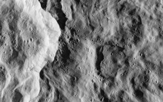 <h1>PIA07764:  Catch that Crater</h1><div class="PIA07764" lang="en" style="width:800px;text-align:left;margin:auto;background-color:#000;padding:10px;max-height:150px;overflow:auto;"><p>In the nick of time, the Cassini spacecraft snapped this image of the eastern rim of Saturn's moon Rhea's bright, ray crater. The impact event appears to have made a prominent bright splotch on the leading hemisphere of Rhea (see <a href="/catalog/PIA06648">PIA06648</a>). Because Cassini was traveling so fast relative to Rhea as the flyby occurred, the crater would have been out of the camera's field of view in any earlier or later exposure.</p><p>The crater's total diameter is about 50 kilometers (30 miles), but this rim view shows details of terrains both interior to the crater and outside its rim. The prominent bright scarp, left of the center, is the crater wall, and the crater interior is to the left of the scarp. The exterior of the crater (right of the scarp) is characterized by softly undulating topography and gentle swirl-like patterns that formed during the emplacement of the large crater's continuous blanket of ejecta material.</p><p>Numerous small craters conspicuously pepper the larger crater's floor and much of the area immediately outside of it. However, in some places, such as terrain in the top portion of the image and the bright crater wall, the terrain appears remarkably free of the small impacts. The localized "shot pattern" and non-uniform distribution of these small craters indicate that they are most likely secondary impacts -- craters formed from fallback material excavated from a nearby primary impact site. Because they exist both inside and outside the large crater in this image, the source impact of the secondary impacts must have happened more recently than the impact event that formed the large crater in this scene.</p><p>This is one of the highest-resolution images of Rhea's surface obtained during Cassini's very close flyby on Nov. 26, 2005, during which the spacecraft swooped to within 500 kilometers (310 miles) of the large moon. Rhea is 1,528 kilometers (949 miles) across and is Saturn's second largest moon, after planet-sized Titan.</p><p>The clear filter image was acquired with the wide-angle camera at an altitude of 511 kilometers (317 miles) above Rhea. Image scale is about 34 meters (112 feet) per pixel. </p><p>The Cassini-Huygens mission is a cooperative project of NASA, the European Space Agency and the Italian Space Agency. The Jet Propulsion Laboratory, a division of the California Institute of Technology in Pasadena, manages the mission for NASA's Science Mission Directorate, Washington, D.C. The Cassini orbiter and its two onboard cameras were designed, developed and assembled at JPL. The imaging operations center is based at the Space Science Institute in Boulder, Colo.</p></p>For more information about the Cassini-Huygens mission visit <a href="http://saturn.jpl.nasa.gov">http://saturn.jpl.nasa.gov</a>. The Cassini imaging team homepage is at <a href="http://ciclops.org">http://ciclops.org</a>.</p><br /><br /><a href="http://photojournal.jpl.nasa.gov/catalog/PIA07764" onclick="window.open(this.href); return false;" title="Voir l'image 	 PIA07764:  Catch that Crater	  sur le site de la NASA">Voir l'image 	 PIA07764:  Catch that Crater	  sur le site de la NASA.</a></div>