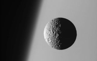 <h1>PIA08172:  Sharp Focus on Mimas</h1><div class="PIA08172" lang="en" style="width:800px;text-align:left;margin:auto;background-color:#000;padding:10px;max-height:150px;overflow:auto;"><p>This amazing perspective view captures battered Mimas against the hazy limb of Saturn.</p><p>It is obvious in such close-up images that Mimas (397 kilometers, or 247 miles across) has been badly scarred by impacts over the eons. Its 130 kilometer- (80 mile-) wide crater, Herschel, lies in the darkness at right.</p><p>North on Mimas is up and rotated 19 degrees to the right.</p><p>The image was taken with the Cassini spacecraft narrow-angle camera on March 21, 2006 using a filter sensitive to wavelengths of ultraviolet light centered at 338 nanometers. The image was acquired at a distance of approximately 191,000 kilometers (119,000 miles) from Mimas and at a Sun-Mimas-spacecraft, or phase, angle of 91 degrees. Image scale is 1 kilometer (3,730 feet) per pixel.</p><p>The Cassini-Huygens mission is a cooperative project of NASA, the European Space Agency and the Italian Space Agency. The Jet Propulsion Laboratory, a division of the California Institute of Technology in Pasadena, manages the mission for NASA's Science Mission Directorate, Washington, D.C. The Cassini orbiter and its two onboard cameras were designed, developed and assembled at JPL. The imaging operations center is based at the Space Science Institute in Boulder, Colo.</p><p>For more information about the Cassini-Huygens mission visit <a href="http://saturn.jpl.nasa.gov">http://saturn.jpl.nasa.gov/home/index.cfm</a>. The Cassini imaging team homepage is at <a href="http://ciclops.org">http://ciclops.org</a>.</p><br /><br /><a href="http://photojournal.jpl.nasa.gov/catalog/PIA08172" onclick="window.open(this.href); return false;" title="Voir l'image 	 PIA08172:  Sharp Focus on Mimas	  sur le site de la NASA">Voir l'image 	 PIA08172:  Sharp Focus on Mimas	  sur le site de la NASA.</a></div>