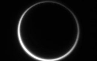 <h1>PIA08268:  Titan's Halo</h1><div class="PIA08268" lang="en" style="width:493px;text-align:left;margin:auto;background-color:#000;padding:10px;max-height:150px;overflow:auto;"><p>Titan's murky atmosphere shines as a halo of scattered light.</p><p>Prior to the Cassini spacecraft's arrival, Titan remained incognito, swathed in its impenetrable envelope of frigid gases. Now, gradually but relentlessly, the veil continues to fall away under Cassini's gaze, bringing the wonders of this world into view.</p><p>North on Titan (5,150 kilometers, or 3,200 miles across) is up.</p><p>The image was taken using a spectral filter sensitive to wavelengths of infrared light centered at 938 nanometers. The image was acquired with the Cassini spacecraft narrow-angle camera on Aug. 10, 2006 at a distance of approximately 3.1 million kilometers (1.9 million miles) from Titan and at a Sun-Titan-spacecraft, or phase, angle of 165 degrees. Image scale is 18 kilometers (11 miles) per pixel.</p><p>The Cassini-Huygens mission is a cooperative project of NASA, the European Space Agency and the Italian Space Agency. The Jet Propulsion Laboratory, a division of the California Institute of Technology in Pasadena, manages the mission for NASA's Science Mission Directorate, Washington, D.C. The Cassini orbiter and its two onboard cameras were designed, developed and assembled at JPL. The imaging operations center is based at the Space Science Institute in Boulder, Colo.</p><p>For more information about the Cassini-Huygens mission visit <a href="http://saturn.jpl.nasa.gov">http://saturn.jpl.nasa.gov/home/index.cfm</a>. The Cassini imaging team homepage is at <a href="http://ciclops.org">http://ciclops.org</a>.</p><br /><br /><a href="http://photojournal.jpl.nasa.gov/catalog/PIA08268" onclick="window.open(this.href); return false;" title="Voir l'image 	 PIA08268:  Titan's Halo	  sur le site de la NASA">Voir l'image 	 PIA08268:  Titan's Halo	  sur le site de la NASA.</a></div>