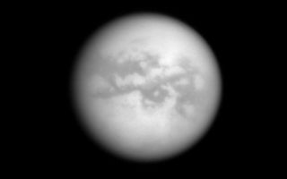 <h1>PIA10514:  Saturn's View of Titan</h1><div class="PIA10514" lang="en" style="width:791px;text-align:left;margin:auto;background-color:#000;padding:10px;max-height:150px;overflow:auto;"><p>The Cassini spacecraft looks through Titan's thick atmosphere to reveal bright and dark terrains on the Saturn-facing side of the planet's largest moon. North is up.</p><p>The image was taken with the Cassini spacecraft narrow-angle camera on Oct. 11, 2008 using a spectral filter sensitive to wavelengths of infrared light centered at 938 nanometers. The view was obtained at a distance of approximately 2.222 million kilometers (1.381 million miles) from Titan and at a Sun-Titan-spacecraft, or phase, angle of 10 degrees. Image scale is 13 kilometers (8 miles) per pixel.</p><p>The Cassini-Huygens mission is a cooperative project of NASA, the European Space Agency and the Italian Space Agency. The Jet Propulsion Laboratory, a division of the California Institute of Technology in Pasadena, manages the mission for NASA's Science Mission Directorate, Washington, D.C. The Cassini orbiter and its two onboard cameras were designed, developed and assembled at JPL. The imaging operations center is based at the Space Science Institute in Boulder, Colo.</p><p>For more information about the Cassini-Huygens mission visit <a href="http://saturn.jpl.nasa.gov" class="external free" target="wpext">http://saturn.jpl.nasa.gov/</a>. The Cassini imaging team homepage is at <a href="http://ciclops.org" class="external free" target="wpext">http://ciclops.org</a>.<br /><br /><a href="http://photojournal.jpl.nasa.gov/catalog/PIA10514" onclick="window.open(this.href); return false;" title="Voir l'image 	 PIA10514:  Saturn's View of Titan	  sur le site de la NASA">Voir l'image 	 PIA10514:  Saturn's View of Titan	  sur le site de la NASA.</a></div>