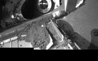 <h1>PIA10900:  Robotic Arm Camera Image of the South Side of the Thermal and Evolved-Gas Analyzer (Door TA4 receiving sample)</h1><div class="PIA10900" lang="en" style="width:512px;text-align:left;margin:auto;background-color:#000;padding:10px;max-height:150px;overflow:auto;"><p>The Thermal and Evolved-Gas Analyzer (TEGA) instrument aboard NASA's Phoenix Mars Lander is shown with one set of oven doors open and dirt from a sample delivery. After the "seventh shake" of TEGA, a portion of the dirt sample entered the oven via a screen for analysis. This image was taken by the Robotic Arm Camera on Sol 18 (June 13, 2008), or 18th Martian day of the mission.</p><p>The Phoenix Mission is led by the University of Arizona, Tucson, on behalf of NASA. Project management of the mission is by NASAs Jet Propulsion Laboratory, Pasadena, Calif. Spacecraft development is by Lockheed Martin Space Systems, Denver.<br /><br /><a href="http://photojournal.jpl.nasa.gov/catalog/PIA10900" onclick="window.open(this.href); return false;" title="Voir l'image 	 PIA10900:  Robotic Arm Camera Image of the South Side of the Thermal and Evolved-Gas Analyzer (Door TA4 receiving sample)	  sur le site de la NASA">Voir l'image 	 PIA10900:  Robotic Arm Camera Image of the South Side of the Thermal and Evolved-Gas Analyzer (Door TA4 receiving sample)	  sur le site de la NASA.</a></div>